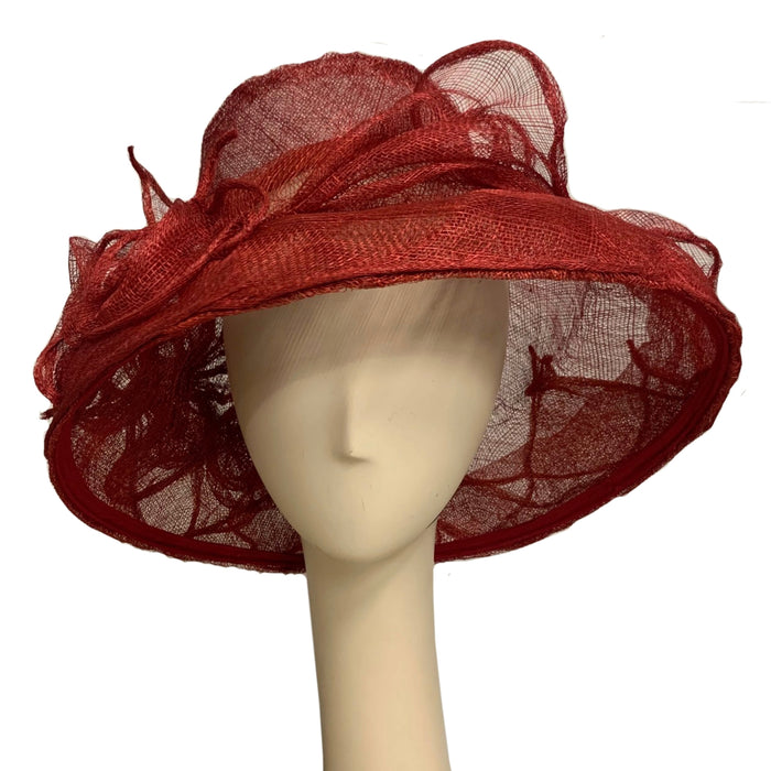 Whimsical red hat on a mannequin head