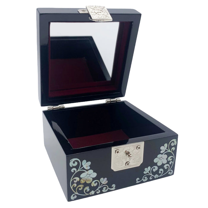 A Korean handcrafted jewelry box with a mother of pearl design featuring two cranes on the lid.