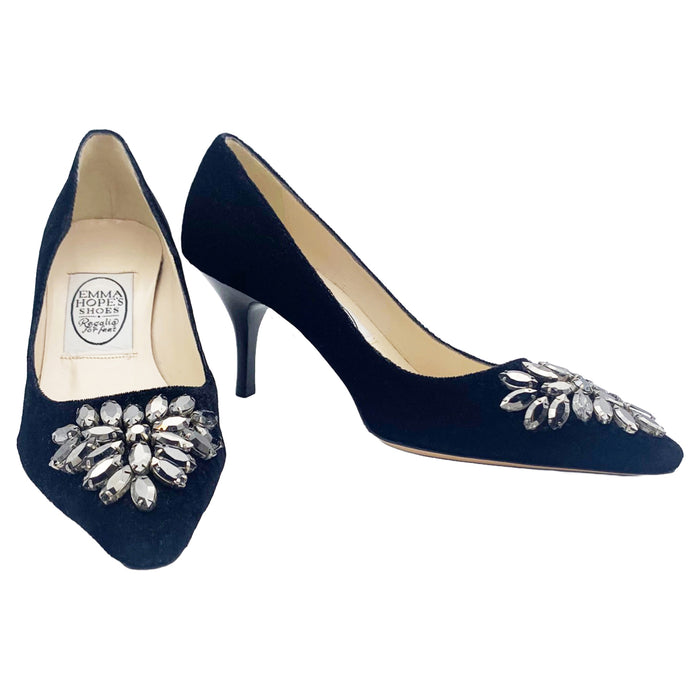 A pair of black velvet high-heeled shoes with dark grey rhinestone embellishments on the front, designed by Emma Hope.