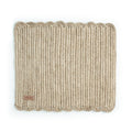 A rectangular, beige, handwoven placemat with a simple pattern.
